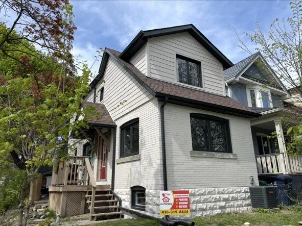 Exterior repaint on an older brick home in Toronto by Co Painting