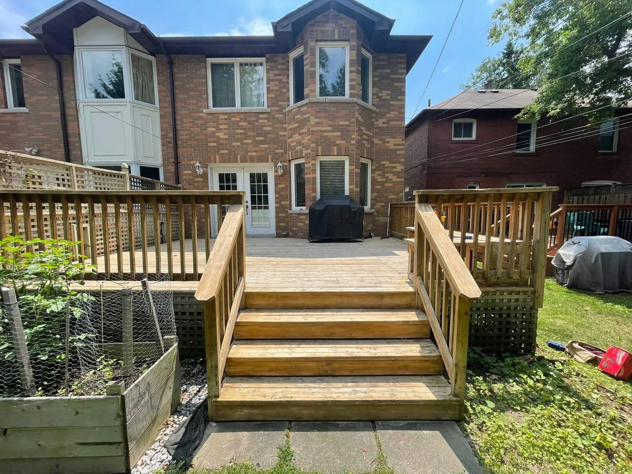 Freshly stained North York deck by Co Painting